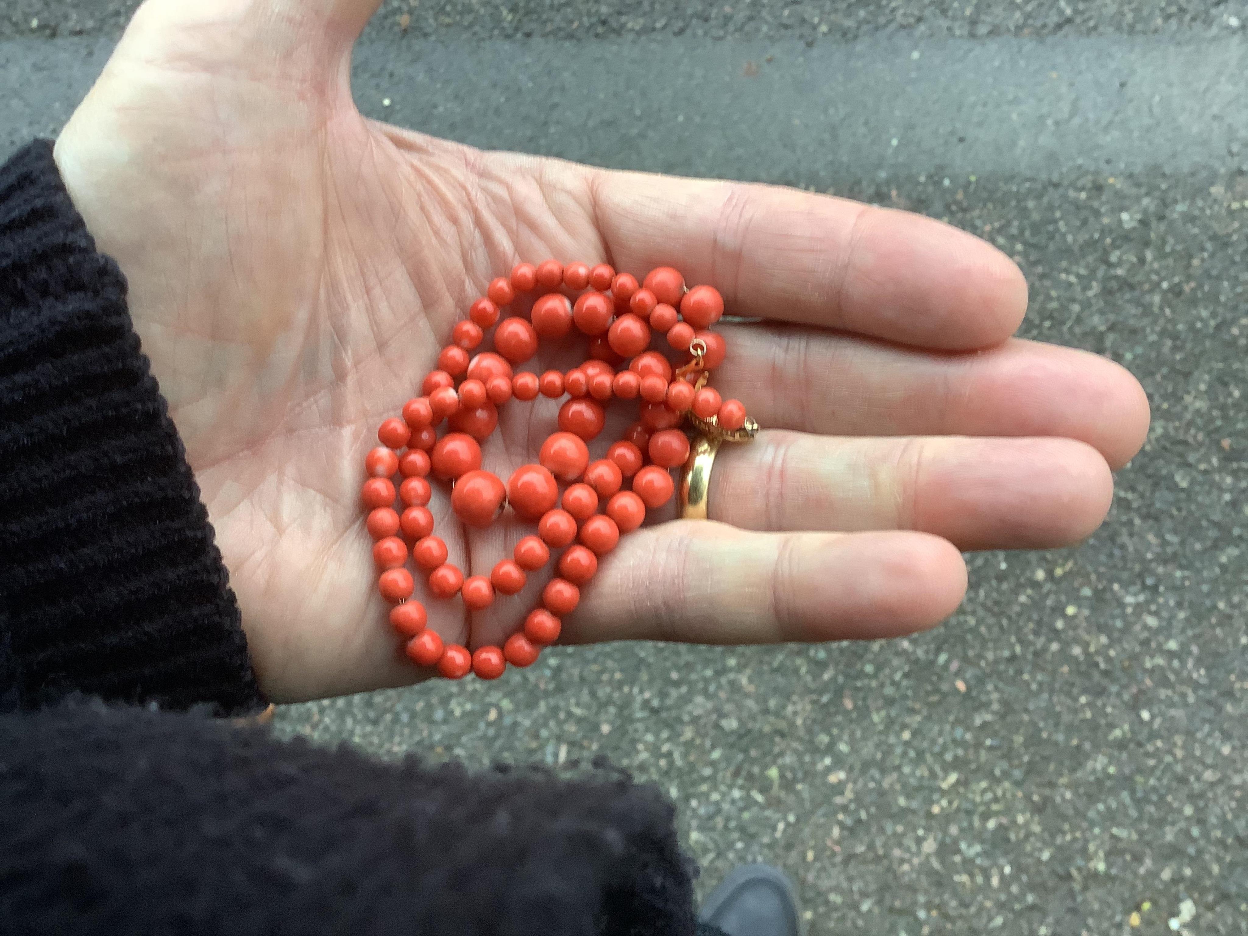 A collection of jewels including a coral demi-parure, comprising: a coral necklace and pair of earrings, lengths 46 and 2.5cm respectively, necklace clasp stamped 14K, earrings with post fittings; a carnelian fob seal wi